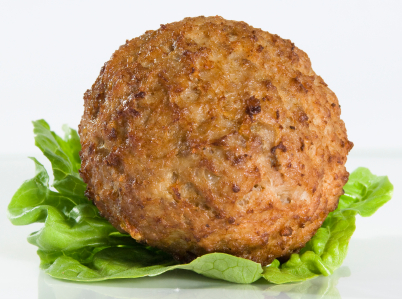 A golden-brown, cooked meat patty, the gift of the perfect meatball tip, resting on a fresh green lettuce leaf.