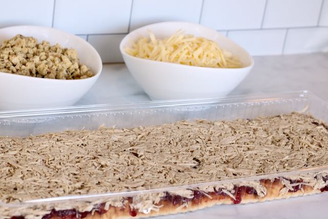 flatbread layered with cranberry sauce and shredded turkey