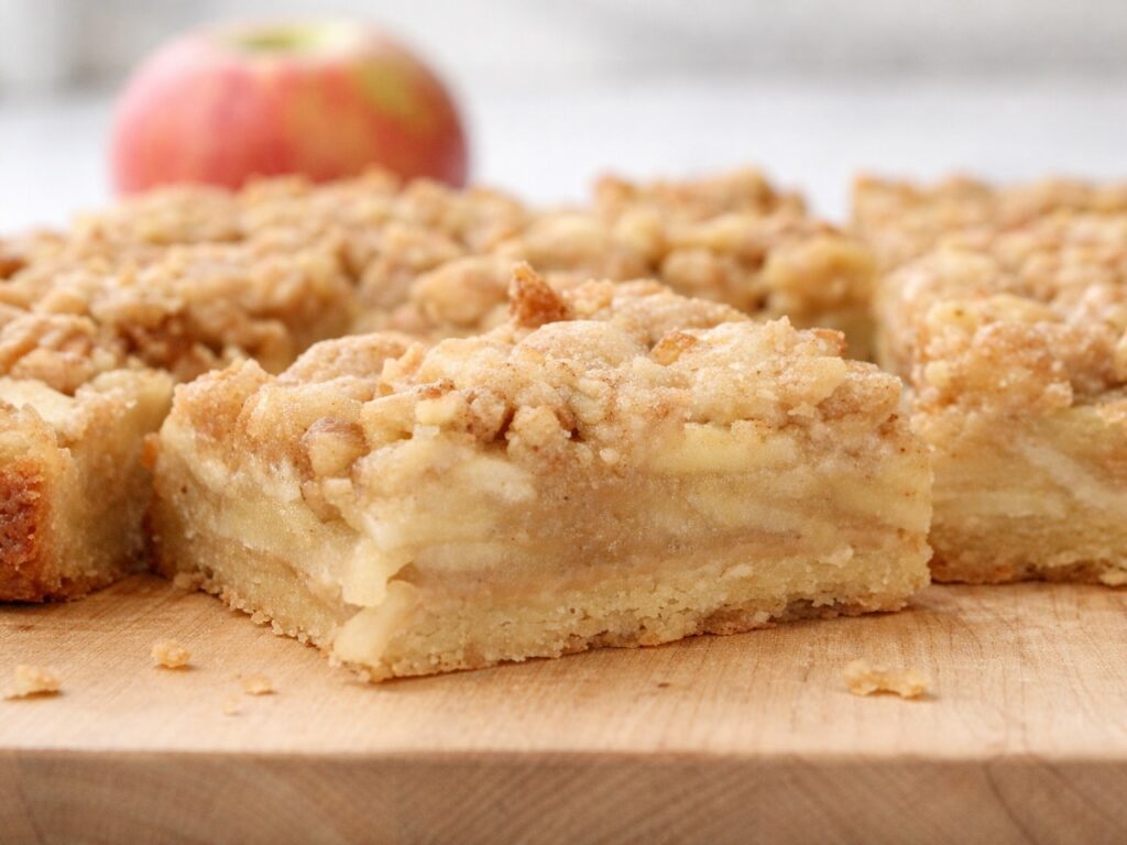 apple pie bars on a wooden board