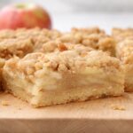 apple pie bars on a wooden board