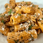Ina Garten's Rigatoni with Sausage & Fennel in a white serving bowl