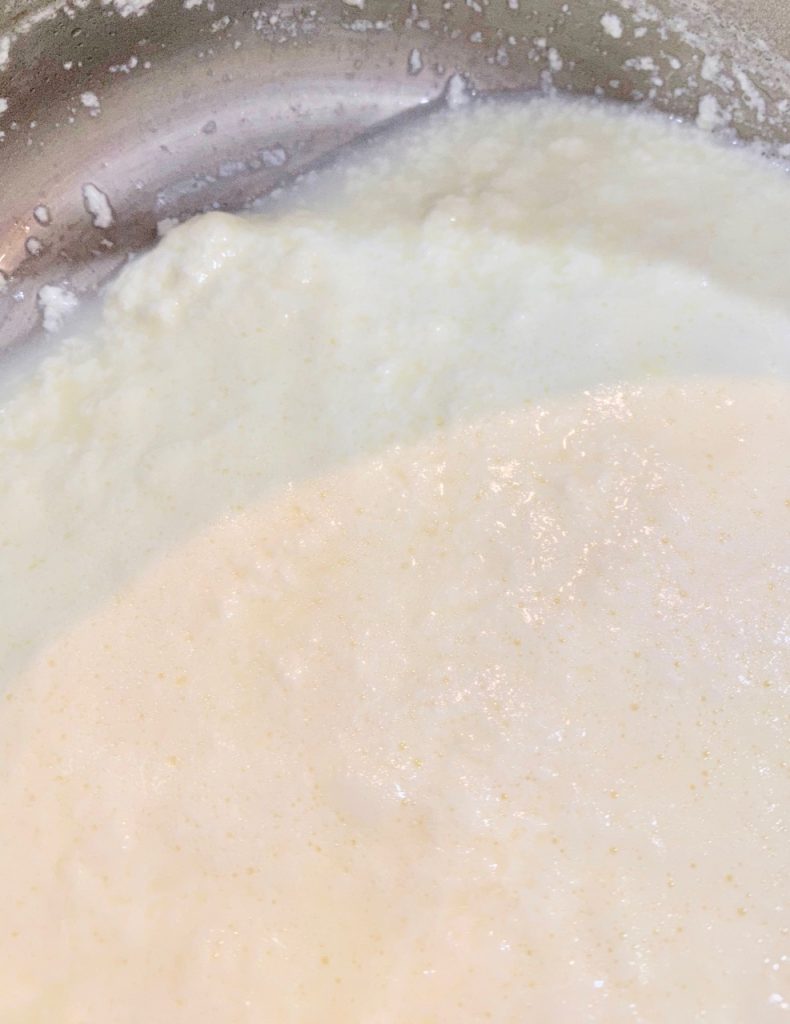 Pot of cream separating from fats to make Ricotta