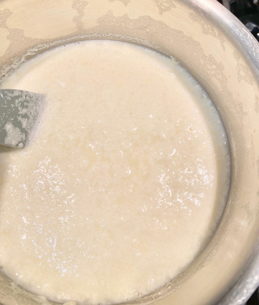 Pot of cream separating from fats