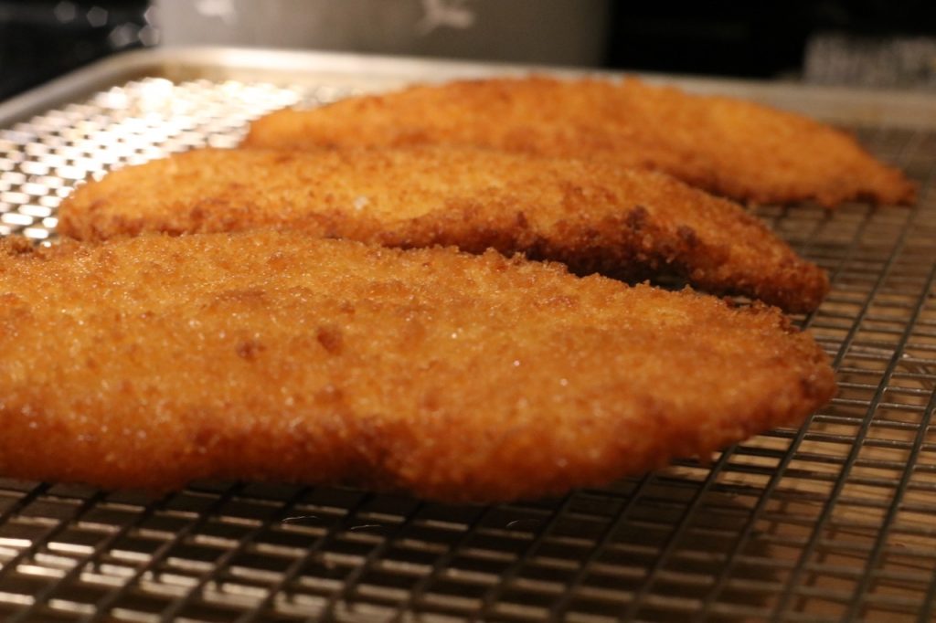 panko fried breadcrumbs on a gridded sheet pan