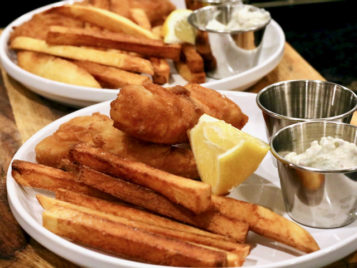 Fish & chips with a lemon wedge and tartar sauce
