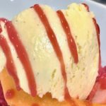 homemade vanilla ice cream with raspberry sauce