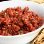 Homemade salsa in a bowl with tortilla chips