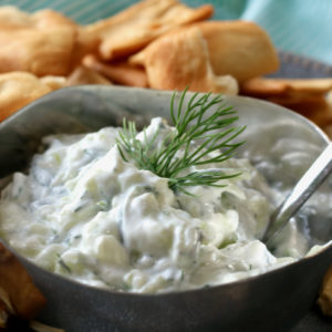 Tzatziki Sauce in a bowl with pita chips