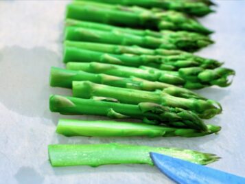 Cutting asparagus for Prosciutto wrapped asparagusAppetizer