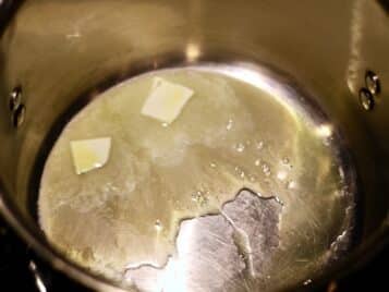 2 tablespoons of butter melting in a pot