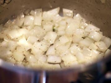 1" chopped onions sautéing in a pot