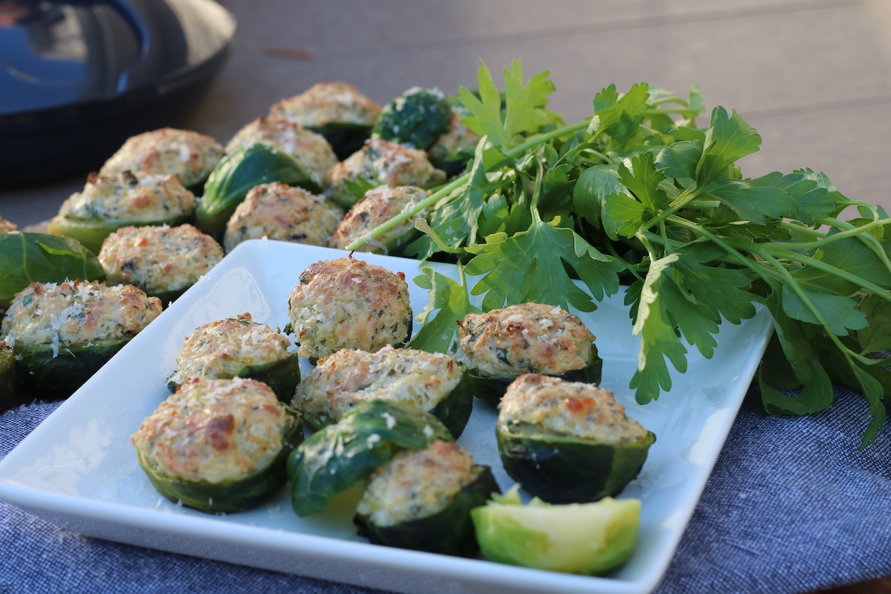 Stuffed brussel sprouts with parmesan and herbs on an appetizer plate