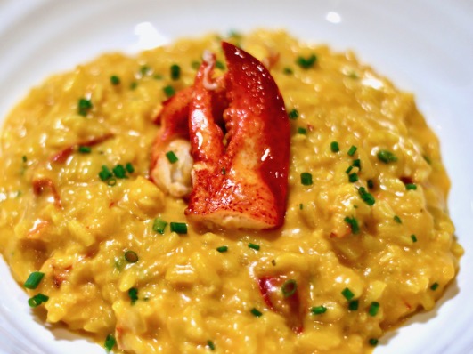 Lobster risotto with a lobster claw for garnish