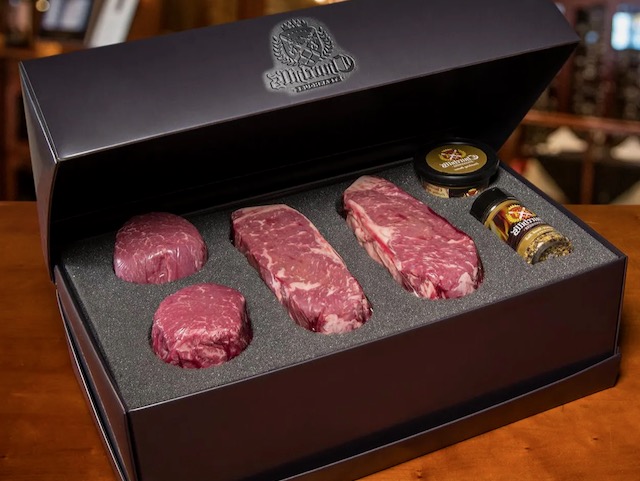 Churchills NY Strip & filet mignon prime steak gift box in luxury black box showcasing 2 of each steak, steak seasoning and steak butter