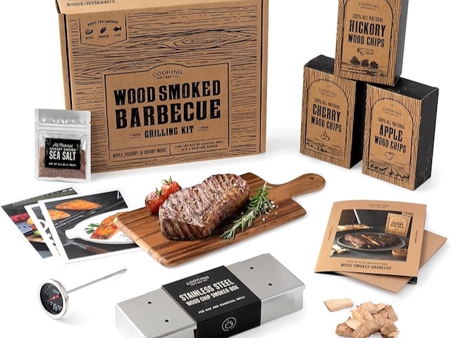 Wood Smoked BBQ Grill Set that shows all the items included and a steak on a cutting board