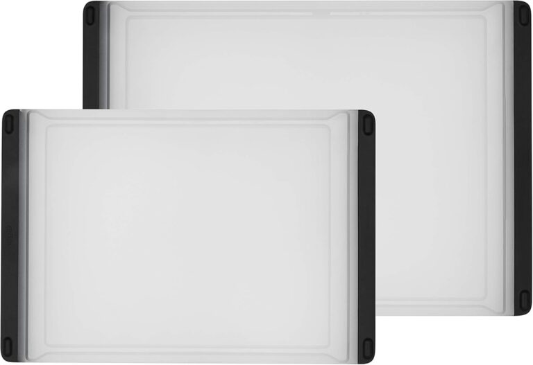 Two rectangular plastic cutting boards with black edges, stacked slightly overlapping.