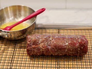 Ina garten's slow roasted beef tenderloin smothered in butter ready to go in the oven
