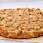 Rustic apple crostata on parchment paper