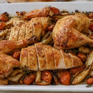 ina garten roast chicken with carrots and fennel on a white serving platter
