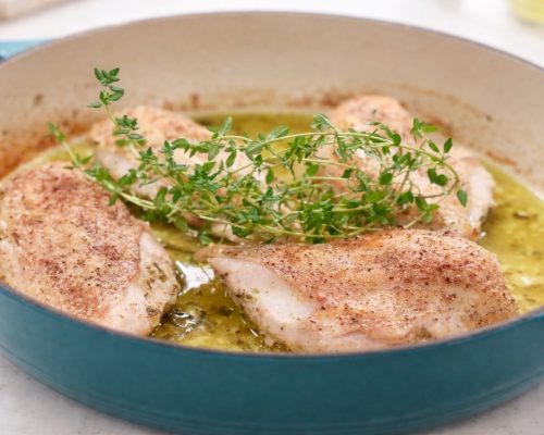 Ina Garten's Lemon Chicken breasts in a teal cooking pan