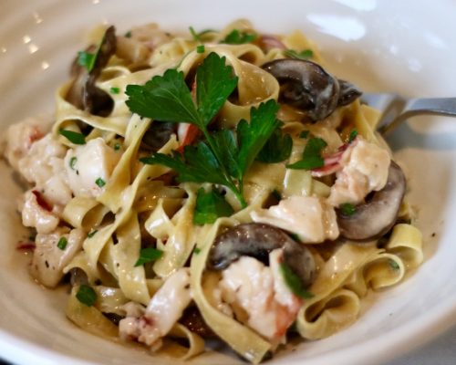 Homemade pasta with truffle butter, mushrooms & lobster