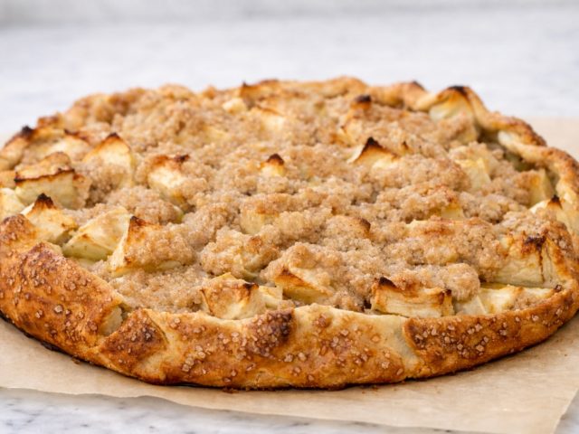 Rustic apple crostata on parchment paper