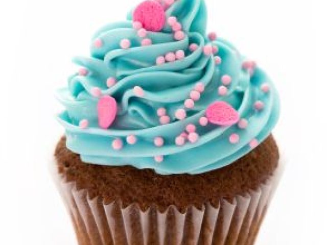 A delicious-looking cupcake with vibrant blue frosting, sprinkled with pink and white edible beads.