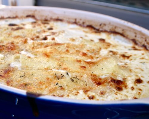 Scalloped potatoes au gratin baked until golden brown & bubbly