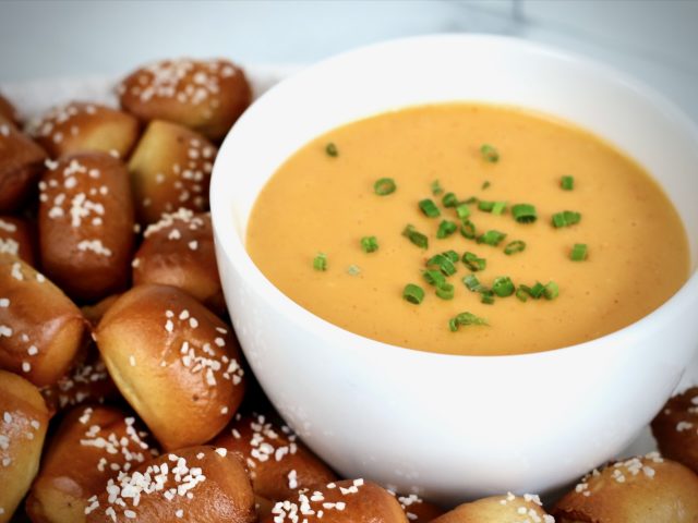 Homemade beer cheese dip served with warm pretzel nuggets