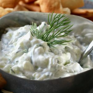 tzatziki sauce in a bowl with pita chips
